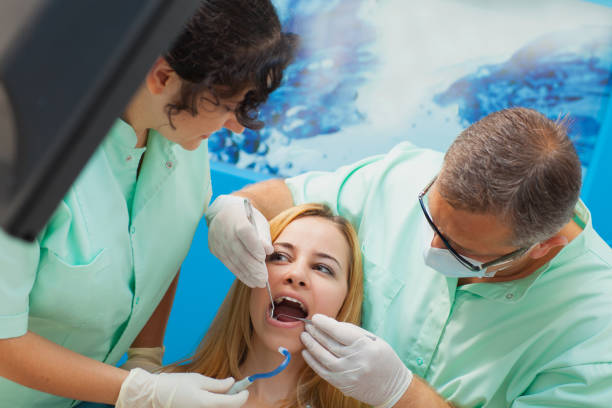istock Young confident woman at dentist's office for routine checkup. 639929610