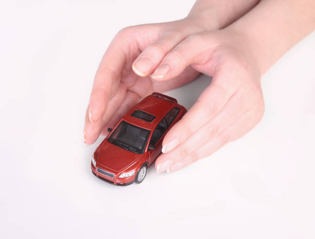 istock toy car in female hands 639930134