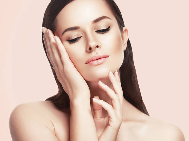 istock Beautiful woman face close up studio on pink 639932076