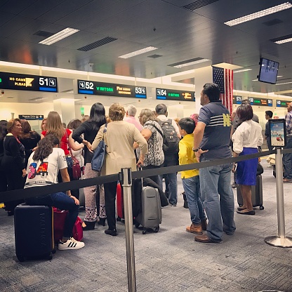 Miami, USA - January 26, 2017: Queue of people waiting for Passport control in Miami Airport. 