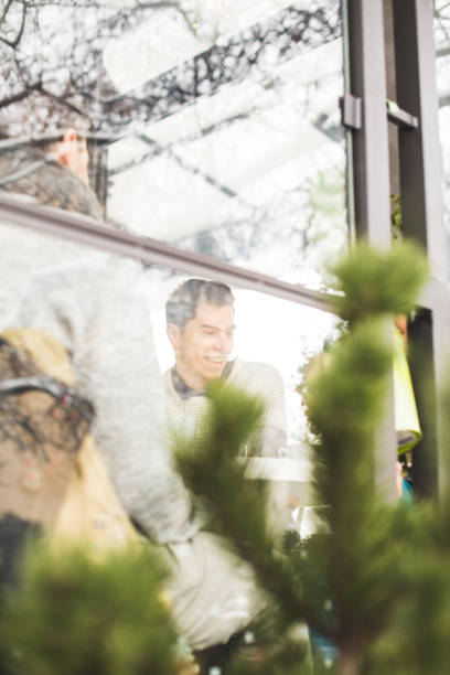 istock Friends in cafe bar, view through cafe window 639934618