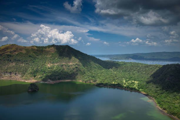 Shot looking down into the water filled caldera of Volcano Island, surrounded by the waters of Taal Lake in Luzon Province, The Philippines.
