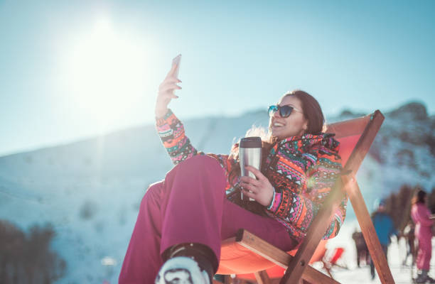istock Young girl taking a photo in deck chair 639936134