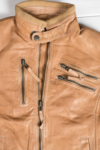 istock Light brown leather jacket. Beige color leather jacket on hanger 639936410