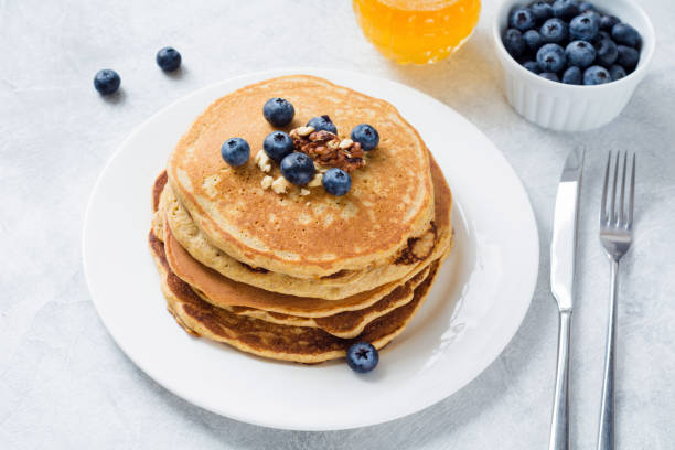 istock Pancakes with blueberries, honey and walnuts 639936516