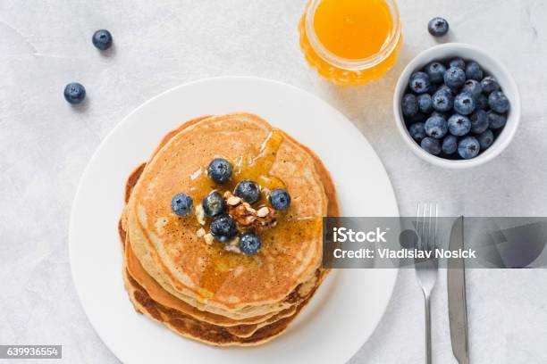 Pancakes With Blueberries Honey And Walnuts Stock Photo - Download Image Now - Pancake, High Angle View, Directly Above