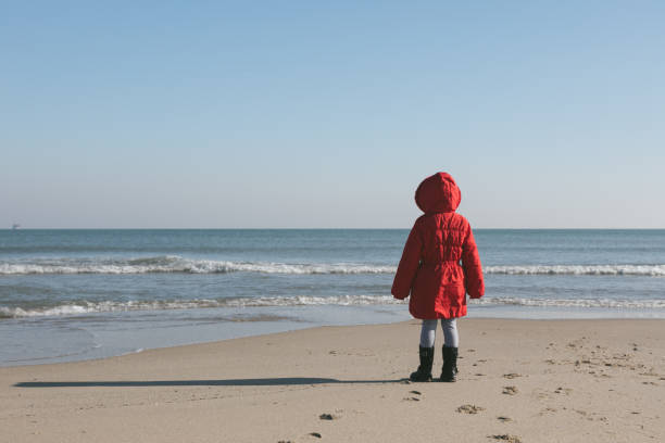 Little girl posing in winter by the sea in Varna Bulgaria