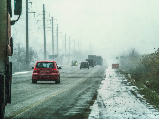 istock Cars driving in a snow storm 639945050