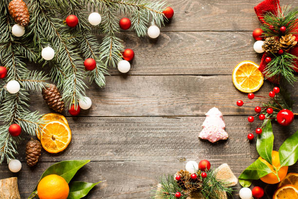 istock Christmas holiday background with ornaments on rustic wooden bac 639945548