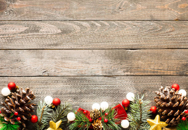 istock Christmas holiday background with ornaments on rustic wooden bac 639945684