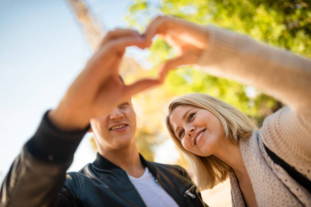 istock woman doing an heart shape in Paris 639946498
