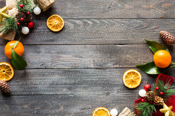 istock Christmas holiday background with ornaments on rustic wooden bac 639946632