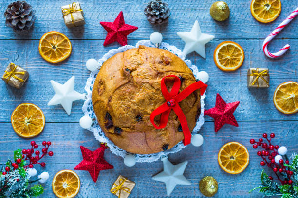 istock Panettone with fruit, and Christmas decoration, on a wooden back 639947256