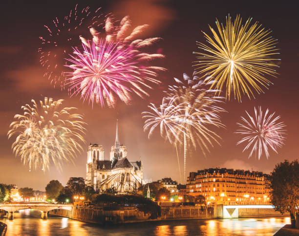 Notre Dame de paris in night with fireworks Notre Dame de paris in night bastille day photos stock pictures, royalty-free photos & images