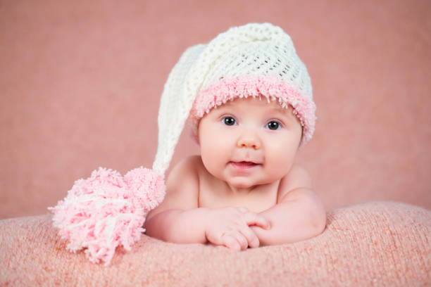 istock Newborn baby in a warm knitted hat. 639948234
