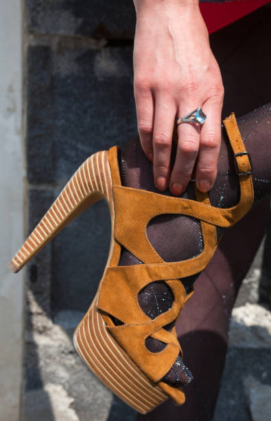 istock Woman's hand fastening the sandals 639949068