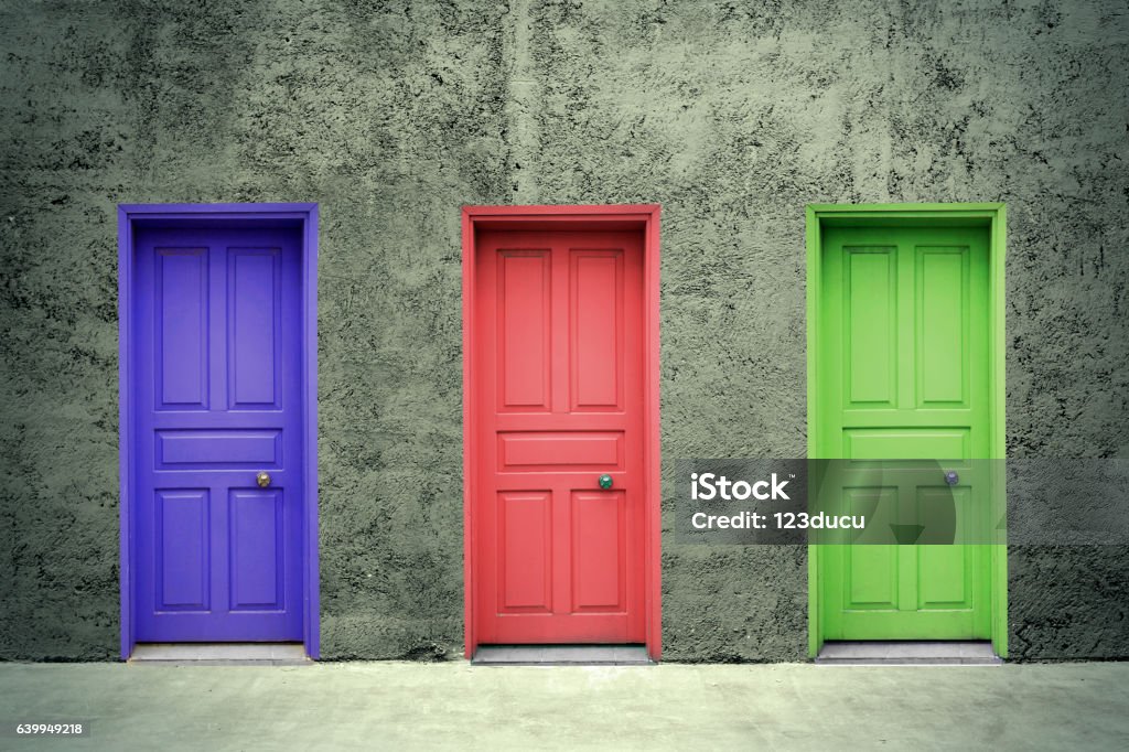 Doors Colorful doors on the concrete wall Three Objects Stock Photo