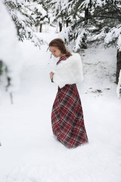 istock Happy woman in winter with snow 639949280