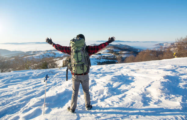 istock Man hiking on the snowy mountain 639949848