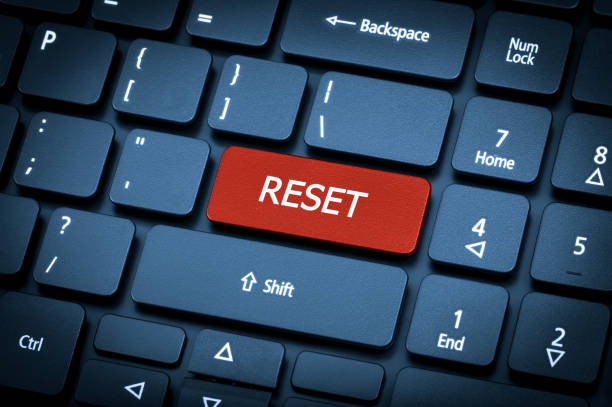 Laptop keyboard. The focus on the Reset key. Close-up laptop keyboard. The focus on the Reset key. Toning is blue. refresh button on keyboard stock pictures, royalty-free photos & images