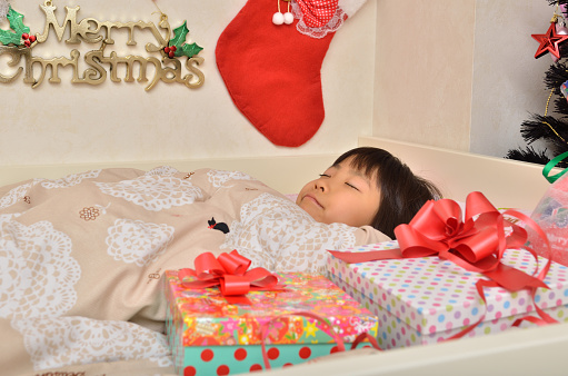 Japanese girl sleeping on the bed