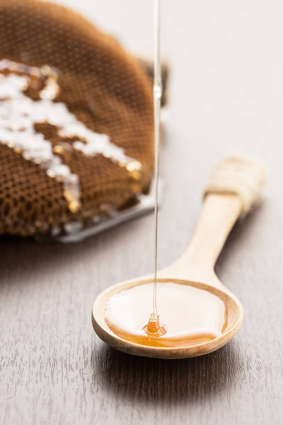 istock close-up honey drop on spoon healthy food concept 639954220