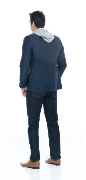 istock Rear view of man standing and looking away 639954264