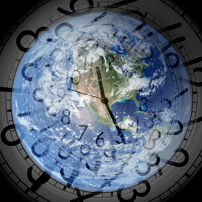 close up transparent clock and world in black, NASA globe image(from image gallery) used, www.nasa.gov