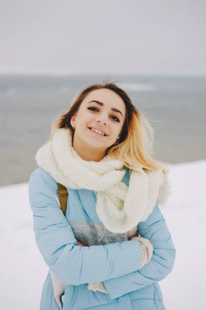 istock beautiful girl on winter walk 639955320