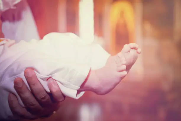 baby foot in the church after the baptism