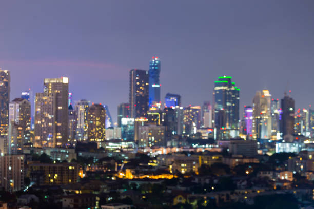 istock Night blurred bokeh lights, office building central business downtown 639961732
