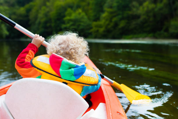 istock Little boy in kayak on hot summer day 639962046