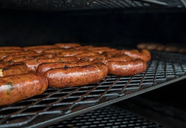 Gourmet Sausages cooking on the Grill stock photo