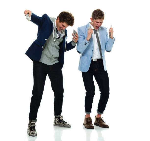 istock Smiling men excited by money 639962900
