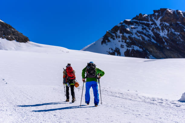 Ice Climbing on glacier in Switzerland - Aletsch Glacier Extreme sports - Ice Climbing on glacier in the mountains of Switzerland - Aletsch Glacier - Europe jungfrau stock pictures, royalty-free photos & images