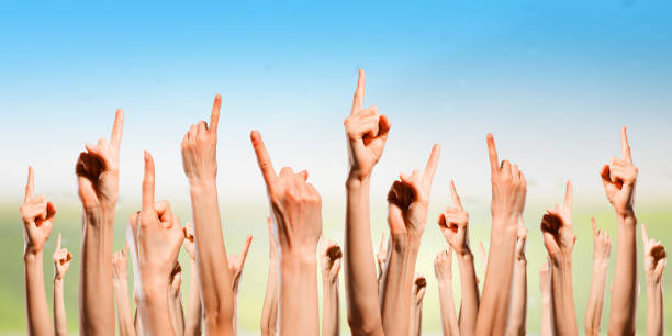 istock Group of people rise hands . Mixed media 639965326