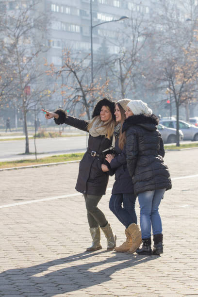 istock Three girls on the street 639967320