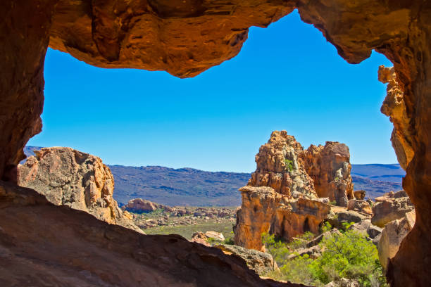 istock View of mountains and rocks through eroded sandstone arch 639967430