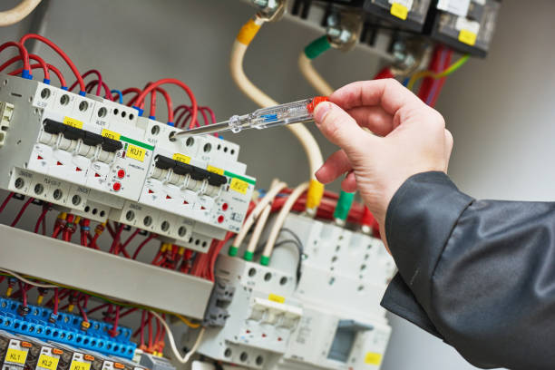 istock electrician examining current voltage with screwdriver tester 639970406