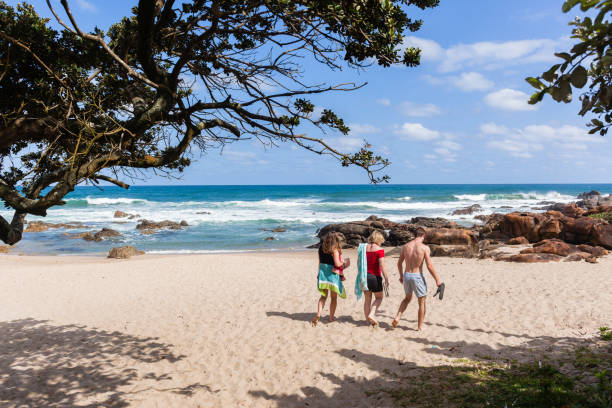 istock Women Man Walking Beach Ocean Coastline 639972840