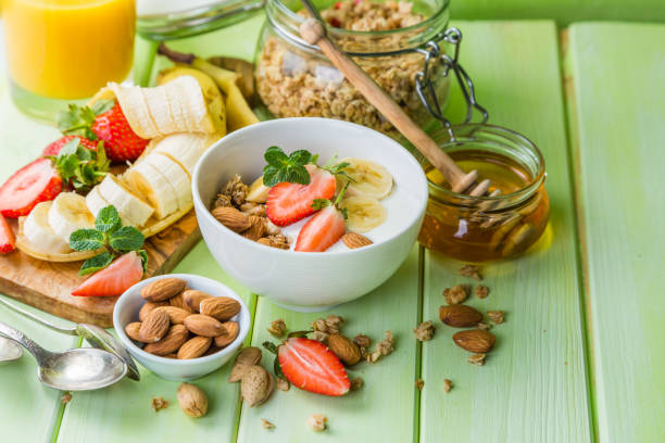 istock Breakfast - strawberry and banana muesli with yogurt 639974742