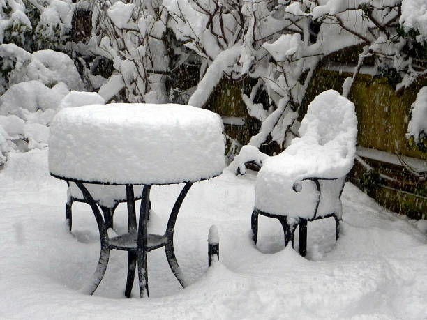 istock Deep snow covers garden table, chairs and plants 639975362