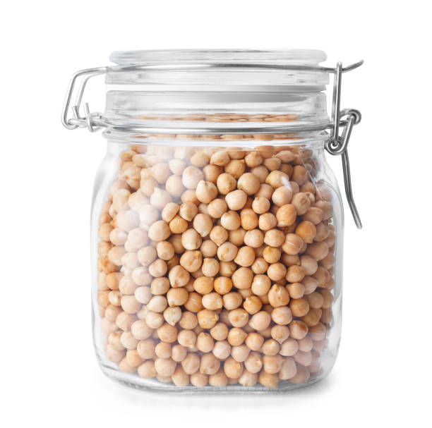 chickpeas in glass jar isolated on white stock photo
