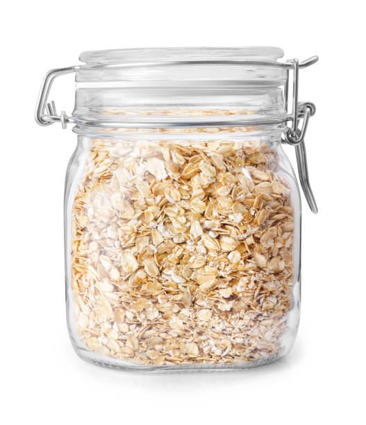 oatmeal in glass jar isolated on white stock photo
