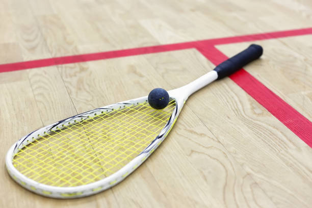 istock squash racket and ball on the court 639978236