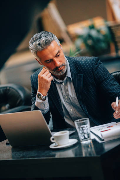 istock Businessman at an internet cafe 639981154
