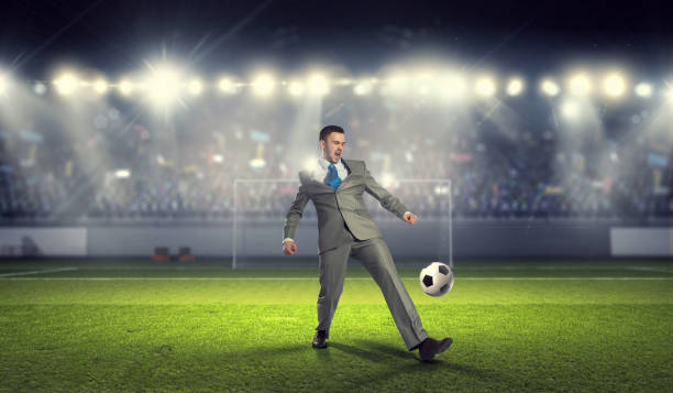 istock Businessman playing soccer . Mixed media 639981396