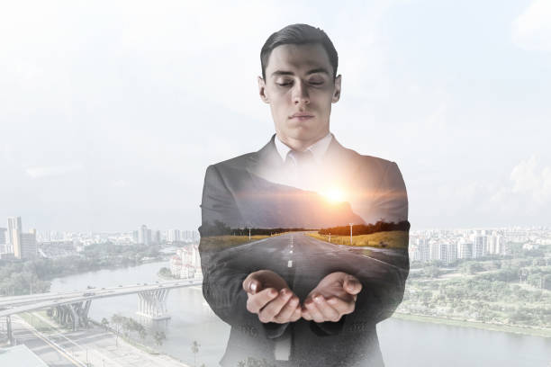 istock Businessman against modern city background . Mixed media 639981448