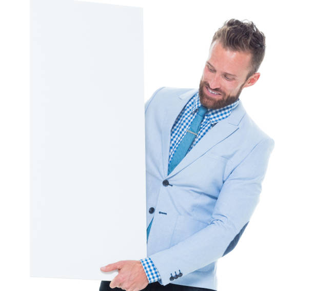istock Smiling businessman holding placard 639983526