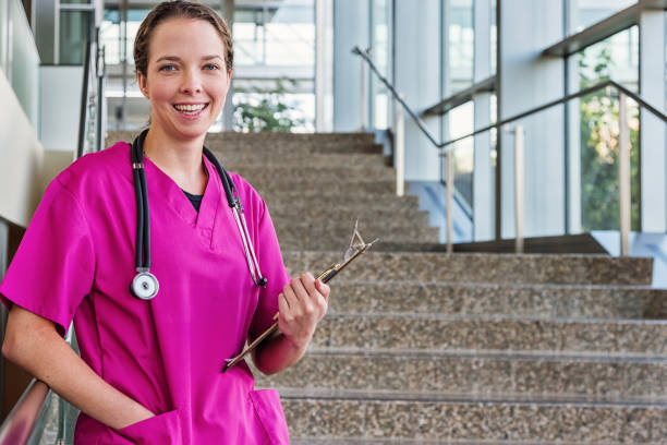 istock Young Friendly Nurse in Pink Scrubs 639985160